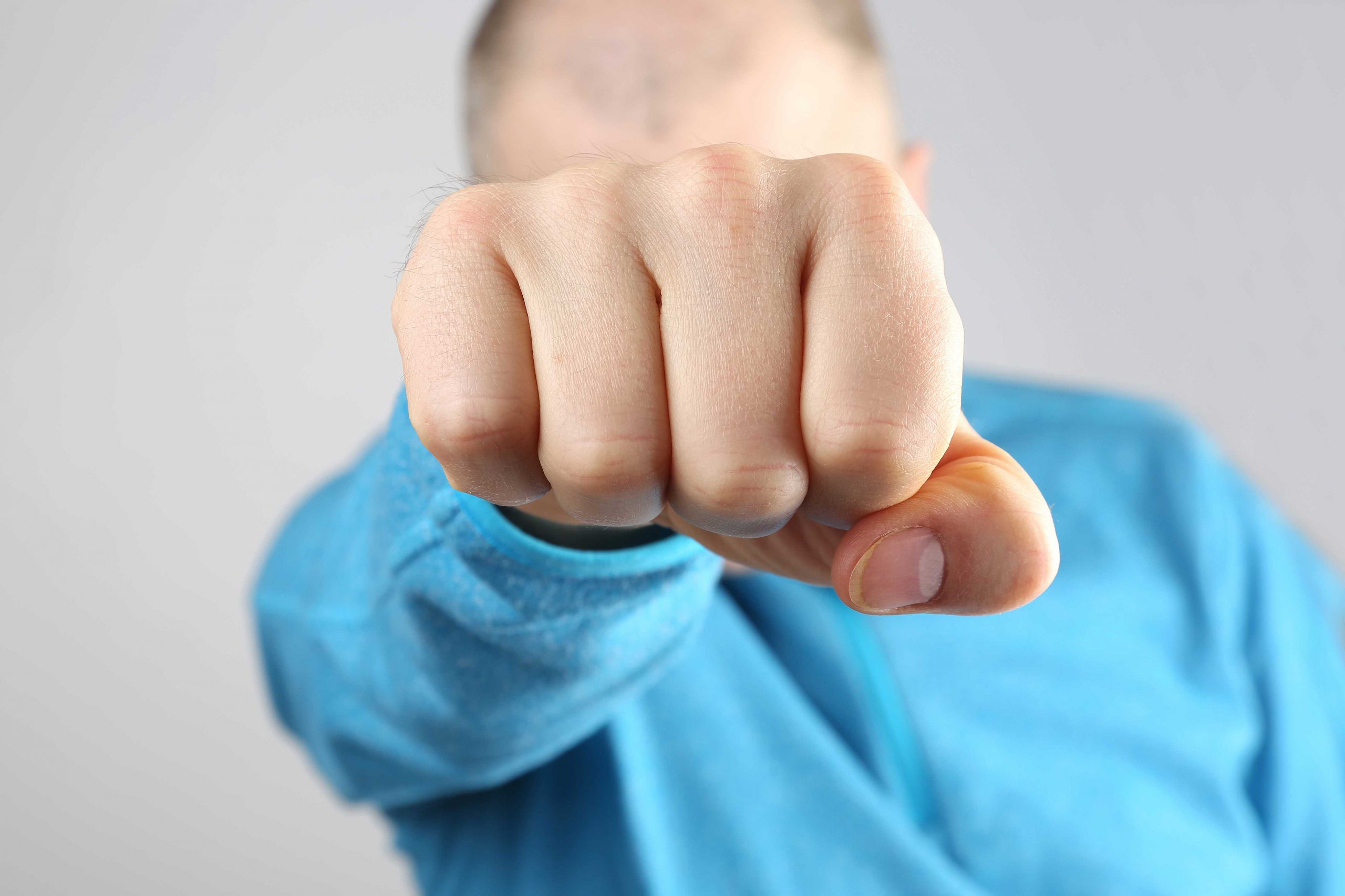 man with long right hand fist scaled